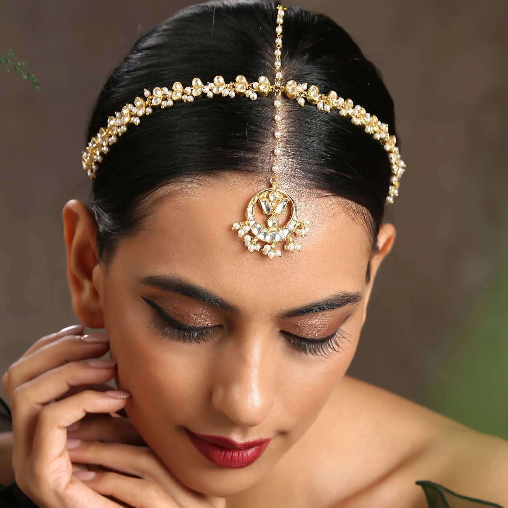 Gold Plated matha patti With Delicately Designed Kundan And Pearl Work