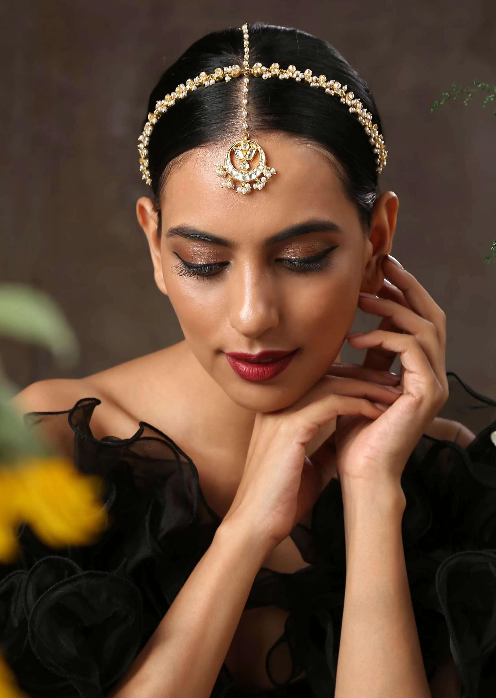 Gold Plated matha patti With Delicately Designed Kundan And Pearl Work