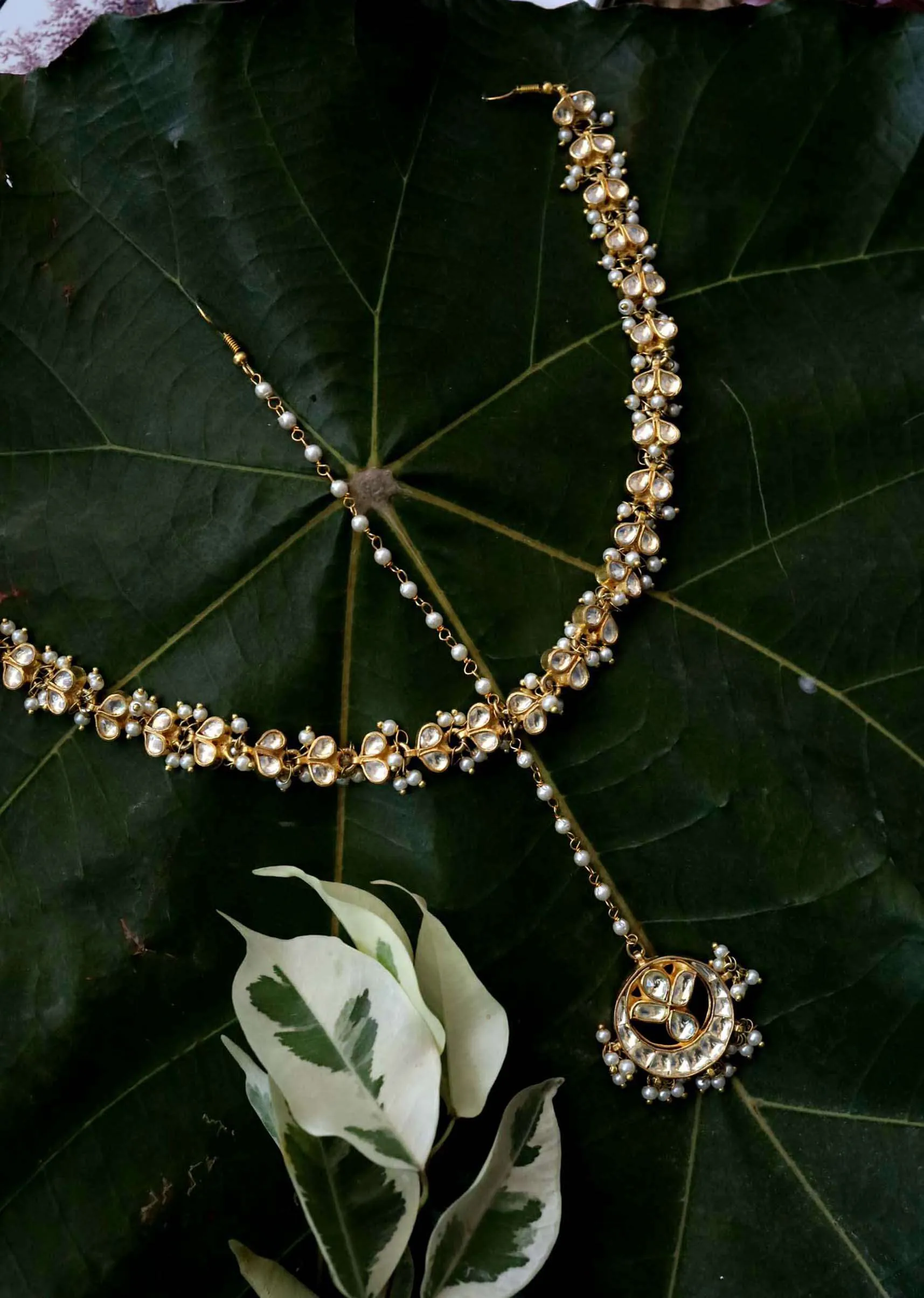 Gold Plated matha patti With Delicately Designed Kundan And Pearl Work