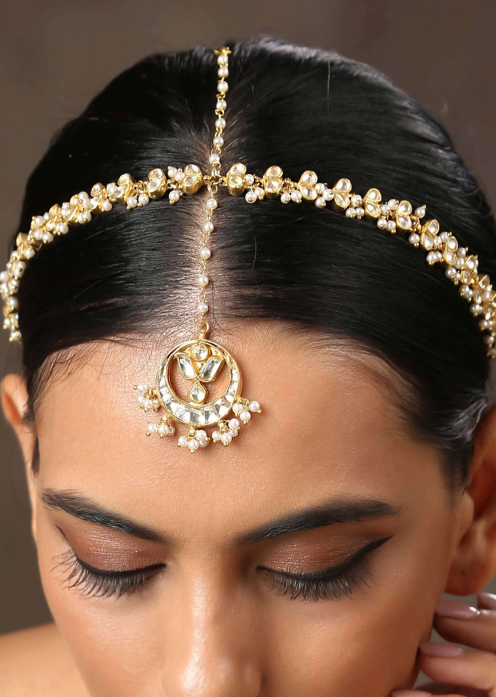 Gold Plated matha patti With Delicately Designed Kundan And Pearl Work